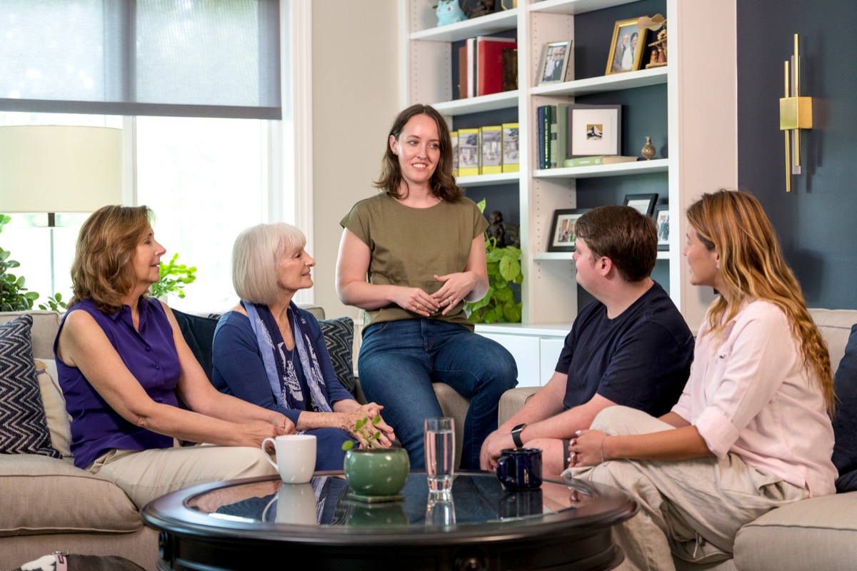 Brittany with a group of volunteers in a living room