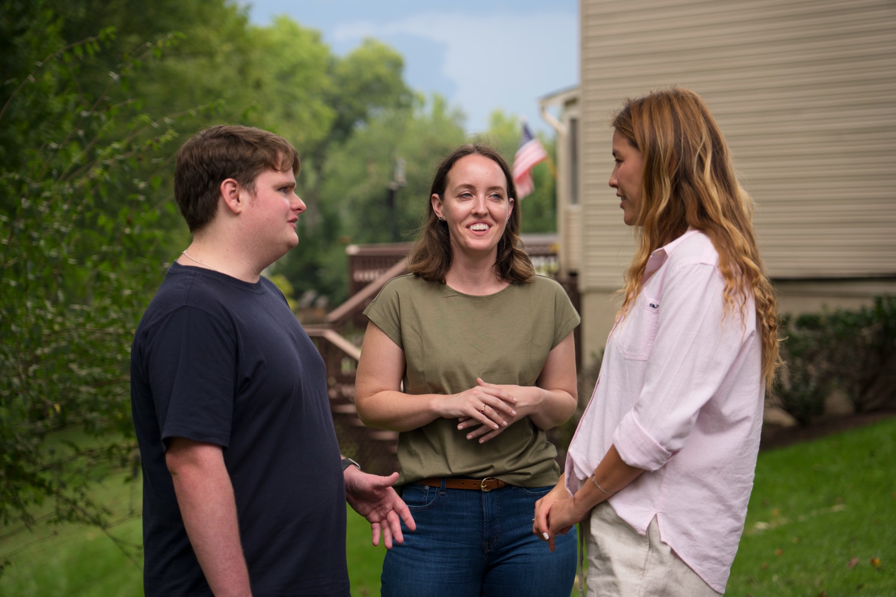 Brittany with volunteers in a backyard
